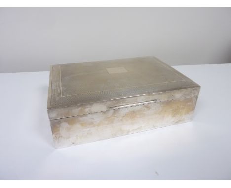 Silver cigar and cigarette box with engine turned lid, Birmingham 1962.  23cm x 16cm. Condition Report. Front of lid slightly