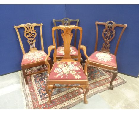 20th century mahogany carver armchair in the George II style with carved cabriole front supports and turned understretchers; 