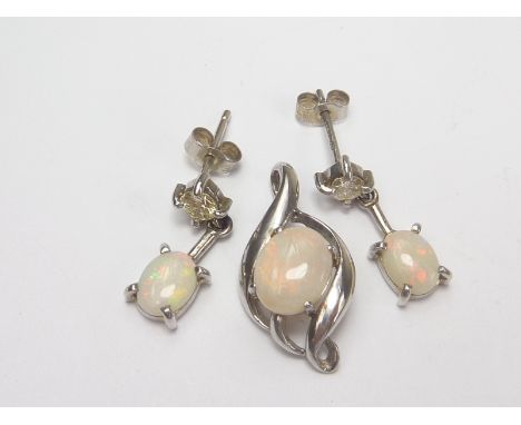 Pair of drop earrings each with an opal and diamond brilliant, 9ct white gold, and a similar pendant, all by Michael King.