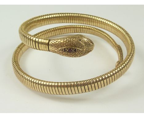 9ct gold snake bangle with gem set head. Condition Report. 38g
