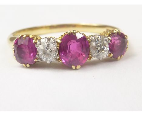 Edwardian ring with three rubies separated by two diamond brilliants in gold 18ct. Size "L 1/2".   Condition Report.  .06ct e