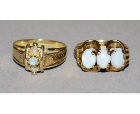 Zwei Opalringe, Gold, 1900-19509kt Gelbgold, besetzt mit einem runden Opal und 2 Perlchen, 3,59 g, Gr. 56; 14kt Gelbgold, bes