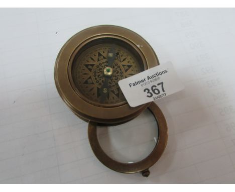 Brass unusual compass with built-in magnifying glass