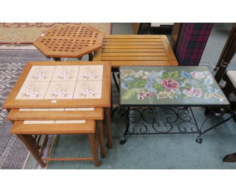 A Danish Toften teak nest of tables with tile top, A small Laxdale teak folding table, Teak side table and a small wrought ir