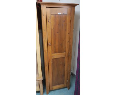 A modern pine hall robe with single door, 183cm high x 63cm wide x 46cm deep Condition Report: Available upon request
