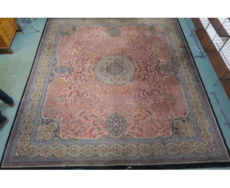 A large pink ground Wilton carpet with central medallion, 400cm x 363cm Condition Report: Available upon request