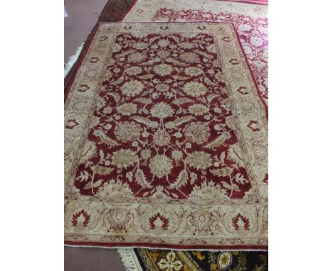 A Pakistan machine made cream and floral carpet, 115" x 79"