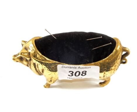 A Brass pin cushion in the form of a pig