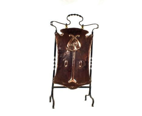 An Art Nouveau wrought iron and embossed Copper firescreen
