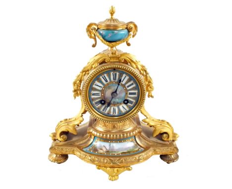 A French Ormolu striking mantel clock with painted porcelain panels (top restoration)