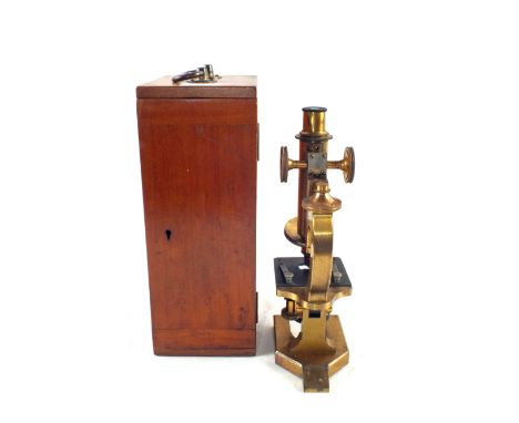 A microscope in fitted case by R & J Beck Ltd, London