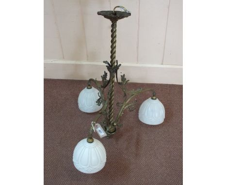 A Brass and floral three branch light fitting with milk glass shades