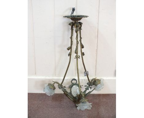 A Brass three branch light fitting with cut glass panels and rose form shades