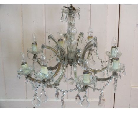 A glass eight branch droplet light fitting