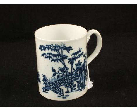 An 18th Century Worcester blue and white mug with house and landscape decoration, crescent mark