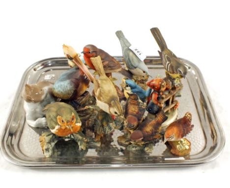 Various bird figurines and a Lladro kitten