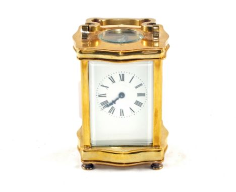 A Brass carriage clock with white enamel dial