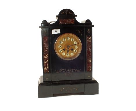 A black and red variegated marble striking mantel clock