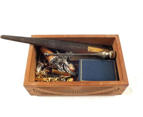 A wooden box containing Silver and Mother of Pearl fruit knife, paper knife of Teak from HMS Iron Duke etc