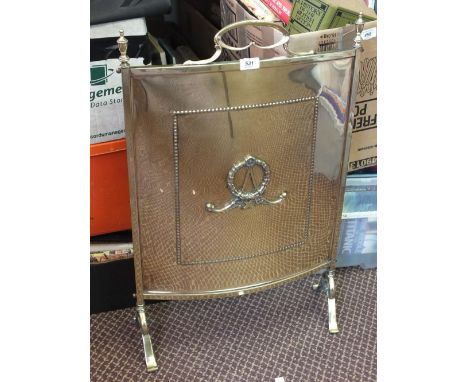 A Victorian Brass firescreen with beaded and applied decoration and a Brass coal helmet