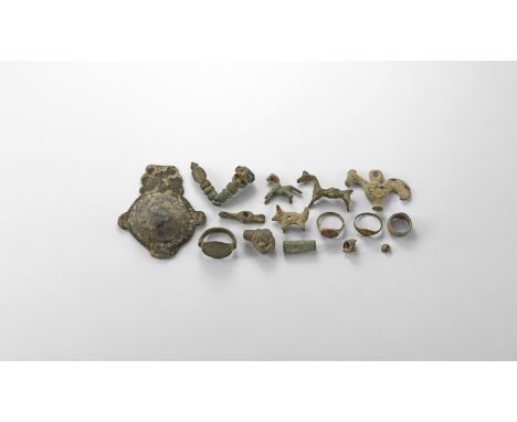 2nd millennium BC-1st millennium AD. A mixed group of mainly bronze items comprising: a cockerel with pierced suspension lug;