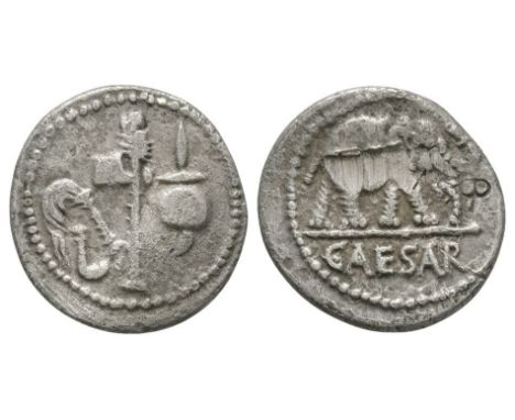 49 BC. Italy. Obv: elphant walking right; CAESAR in exergue. Rev: simpulum, sprinkler, axe and apex. Sear 1399.  3.71 grams. 