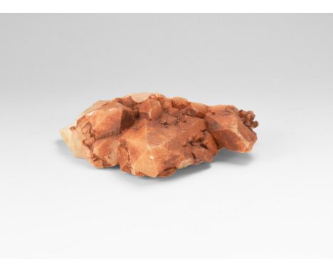 An unusual specimen of quartz crystals with a natural red iron oxide coating, in white card tray.   130 grams, 79mm (3"). Fro