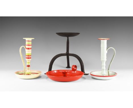20th century AD. A mixed group of metal candlesticks comprising: a broad dish with finger loop and central socket; a candlest