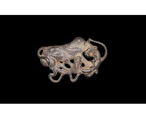 A bronze undated archaistic openwork plaque depicting a combat scene in high relief, a zebu attacked by two wolves and a serp