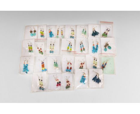 20th century AD. A group of twenty seven pairs of drop earrings with various shaped beads of turquoise, carnelian, glass, gre
