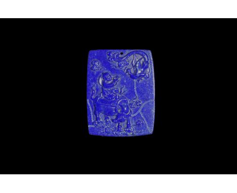 20th century AD. A rectangular lapis lazuli plaque carved with a water buffalo with aboy on its back playing a flute, phoenix