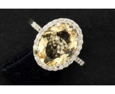 handmade ring in white gold (18 carat) with a ca 3 carat light yellow Beryl and ca 0,40 carat of quality brilliant cut diamon