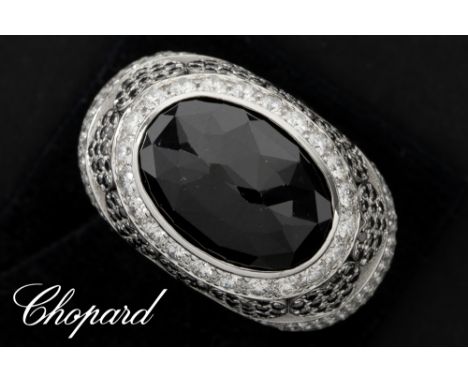 Chopard numbered and signed ring in white gold (18 carat) with a central big black sapphire, black diamonds and  white very h