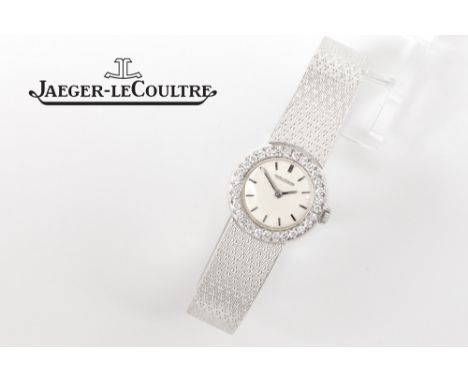 Jaeger - LeCoultre marked mechanic ladies' wristwatch in white gold (18 carat) with a round face surrounded by ca 0,60 carat 