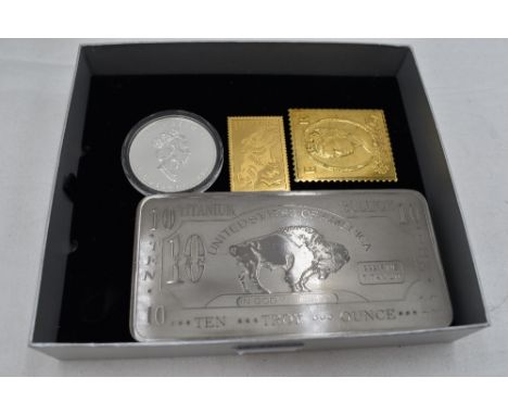 A 10 Troy Ounce Bar of Titanium, a 1996 1 oz Silver Canadian 5 Dollar Coin and two Silver Flags