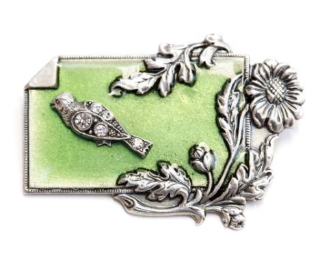 Catherine Popesco, a French Art Deco style enamelled pewter brooch,  depicting a jewel-studded bird and flowers on green enam