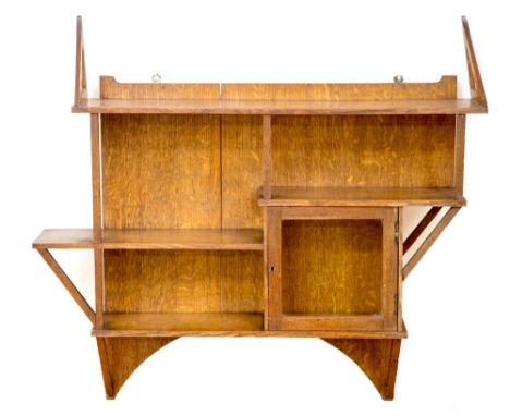 Liberty and Co., an Arts and Crafts oak wall bracket, circa 1895, in the Aesthetic, Japanesque style with glazed cupboard and