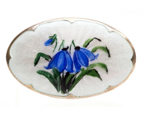 Ivar Holth, a Norwegian silver gilt and enamelled brooch, oval form, white guilloché enamel with hand enamelled blue-bell des