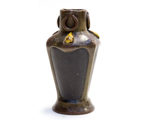 A Bretby Art Pottery vase, circa 1915, of organic form decorated to the shoulder with applied tear drop Ruskin type cabouchon