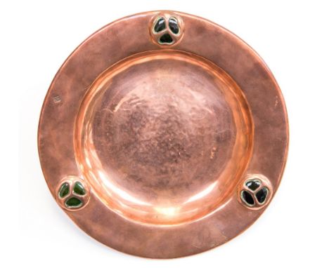 Keswick School of Industrial Arts, an Arts and Crafts copper and enamel dish, circular, hand hammered form with three trefoil