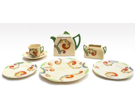 A Royal Doulton Art Deco 'Syren' part tea service, circa 1935, of lobed ogee form, transfer printed with stylised foliate scr