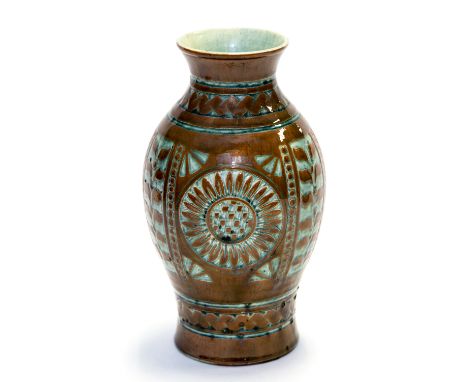 C H Brannam, an Aesthetic Movement art pottery vase by James Dewdney, inverse baluster form with incised sunflower motifs bet