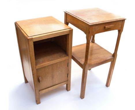 A Cotswold School oak bedside cabinet / table, the single drawer supported on chamfered square section legs united by an open