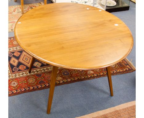 An Ercol light elm drop leaf dining table, oval form with tapered beech legs, 113cm wide, 72cm high, 124cm deep extended