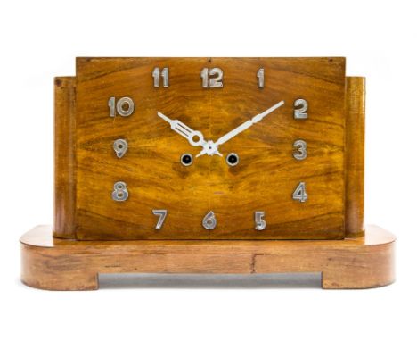 An Art Deco walnut veneered mantle clock, of rectangular stepped form with applied chromium Arabic markers, 48.5cm wide, 27.5