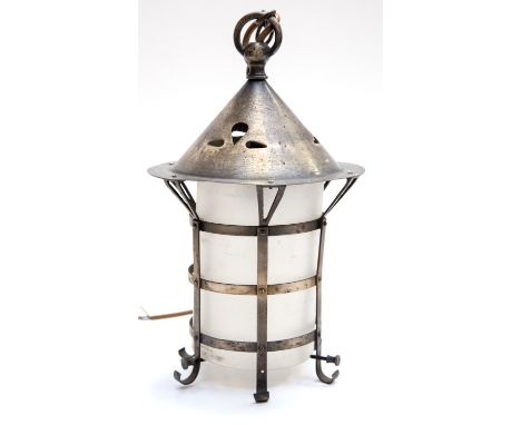 An Arts and Crafts lantern pendant light fitting, in the style of A S Dixon for the Birmingham Guild, the conical top with pi