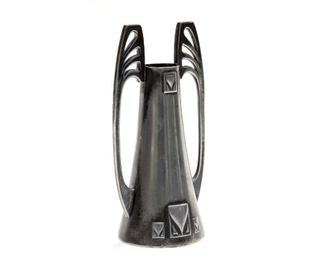 A WMF Jugendstil pewter vase, trumpet form with angular foliate handles and cast abstract cartouches in the Secessionist styl