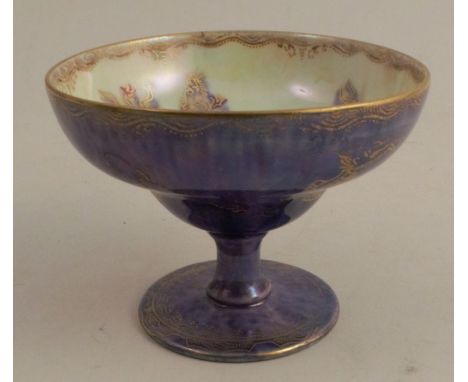 A Wedgwood lustre melba cup, shape no. 2793, decorated with small dragons and aquatic bead ornament, on a mixed blue lustre g