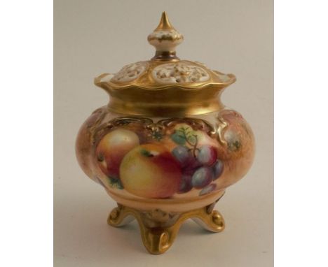 A Royal Worcester covered vase, on four splay feet, decorated with half round hand painted fruit by Roberts, shape number H26