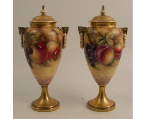A pair of Royal Worcester covered vases, decorated with hand painted fruit by Smith, shape number 2713/2, height 10ins - One 